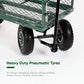 Green garden cart with heavy-duty pneumatic tires on a white background